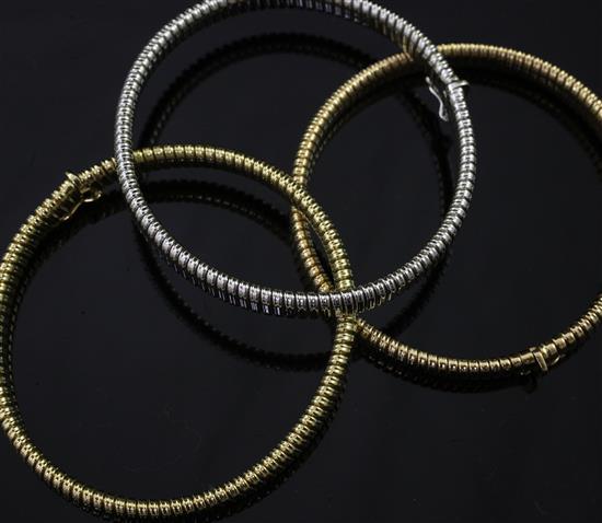 A suite of three Italian 18ct gold articulated bracelets, each 7.5in.